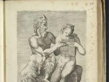 Pan and Daphne sculpture showing a satyr teaching a youthful nude figure to play pan pipes.