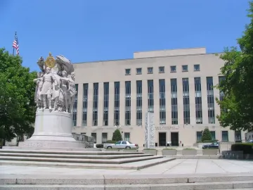 George Gordon Meade Memorial on a stone plaza in front of a courthouse building.