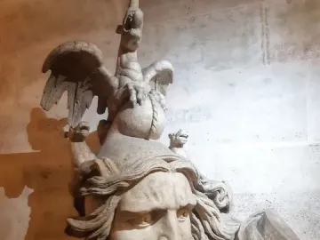 La Marseillaise sculpture showing a shouting armored figure with flowing hair and a winged rooster above the head.