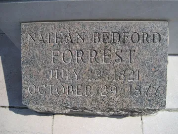 Close-up of the Nathan Bedford Forrest grave marker with carved name and dates.