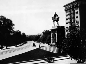 Major General George B. McClellan equestrian statue on an ornate stepped base beside a street with tram tracks.