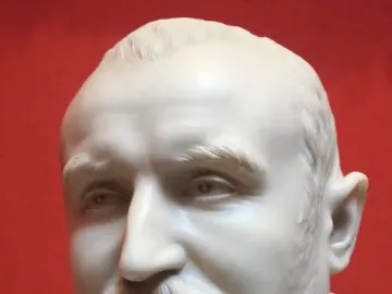 White marble bust of Carlo Antonio del Pozzo with a mustache and goatee against a red background.