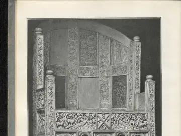 Throne of Maximian with a high curved back and carved relief panels showing robed figures and decorative motifs.