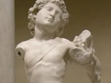 Marble Young Archer statue of a nude youthful male figure with curly hair, missing parts of its arms and legs.