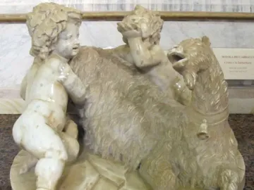 The Goat Amalthea marble sculpture with a shaggy goat and two cherubic figures