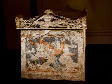 Amazon Sarcophagus with a sculpted lid and faded painted figures on the sarcophagus body