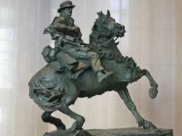 America\'s Response Monument bronze horse soldier statue on a rock-like base
