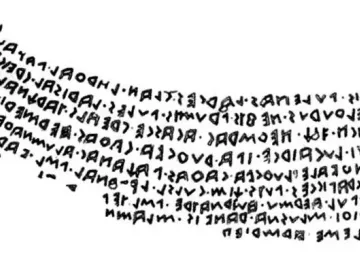 Inscription on the Sarcophagus of Laris Pulenas, shown as several lines of angular carved characters on a white background.