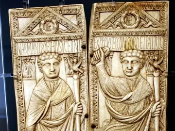 Diptych of Boethius with two carved ivory panels showing robed male figures holding staffs.