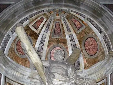 Statue of Saint Andrew in a vaulted niche with marble and gold accents.