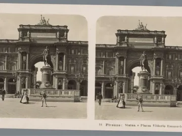 The Victor Emmanuel II Monument in a wide plaza, with a horseback statue in front of a triumphal arch and a few pedestrians nearby.