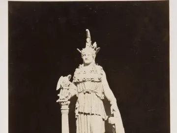 Varvakeion Athena statue holding a small winged figure, with a shield beside her.
