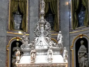 Arca di San Domenico, a richly carved marble monument with figures and reliefs inside a church interior