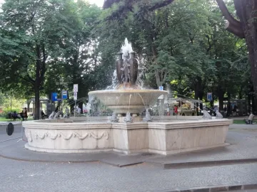 Fountain of the Frogs stone fountain with water cascading into a circular basin
