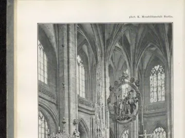 Angelic Salutation, an ornate oval sculpture with carved figures hanging above the church altar.