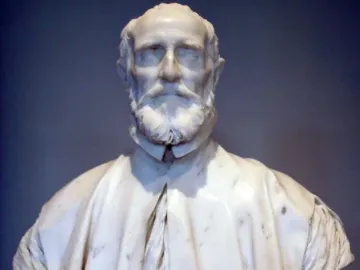 Marble bust of Francesco Barberini with a full beard, wearing a draped cape and collared garment, on an ornate pedestal.