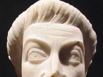 Head of Eutropius, a light-colored stone bust with an elongated face, wavy hair, and a short beard.