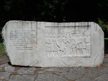 Keys Handover Memorial stone relief with figures and Cyrillic inscription
