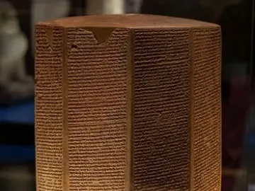 Rassam Prism of Ashurbanipal, a tall multi-faceted prism covered with cuneiform inscriptions.