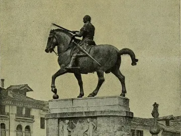 Gattamelata equestrian statue of a helmeted rider on horseback, mounted on a tiered stone pedestal with reliefs.