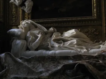 Ecstasy of Blessed Ludovica Albertoni by Bernini, a white marble figure reclining on a sculpted bed with her head tilted back and hands on her chest.