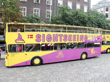 Sightseeing bus with a Little Mermaid graphic and Danish flag on the side