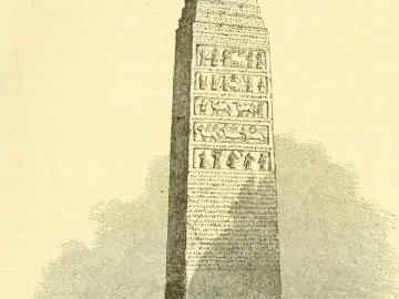 The Black Obelisk shown as a tall tapering monument with carved relief bands and inscriptions on its lower sections.
