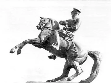 Statue of Honor, an equestrian sculpture of a man in military uniform holding a sword on a rearing horse.