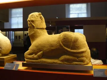 Bicha of Balazote stone sculpture with a bearded human head and reclining animal body
