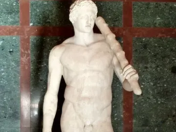 Lansdowne Heracles, a nude marble statue of a muscular beardless man holding a club and lion skin.