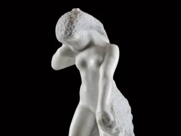 Standing Fauness, a white marble sculpture of a nude female figure with her head bowed and one arm raised.