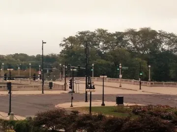 The Bowman and The Spearman bronze equestrian statues on pedestals flanking a roadway.