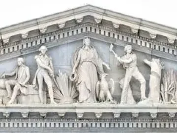 Apotheosis of Democracy pediment with a central standing figure and flanking sculpted groups on the U.S. Capitol