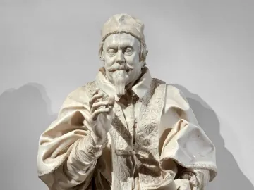 Bernini’s marble bust of Pope Clement X with a raised right hand and a book in the left hand