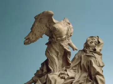 Terracotta model of Ecstasy of Saint Teresa showing a winged figure hovering over a reclining, robed figure