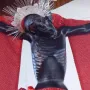 San Juan Patrón crucifix with a silver spiked crown and red drapery