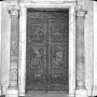 The Filarete Door at St. Peter’s Basilica, shown as an ornate set of double bronze doors with relief panels and fluted columns.
