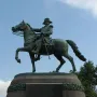 Israel Putnam Monument depicting a bronze military figure on a rearing horse atop a stone pedestal.