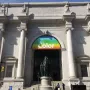 Theodore Roosevelt Equestrian Statue beneath a banner for The Nature of Color at a museum entrance.