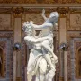 Bernini\'s Rape of Proserpina marble sculpture showing Pluto carrying a struggling Proserpina beside Cerberus