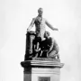 Emancipation Memorial showing a standing man in a suit beside a kneeling man with broken shackles.