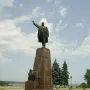 Lenin Monument in Zaporizhzhia with a bronze figure raising one arm on a tall granite pedestal