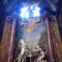 Noli Me Tangere marble sculpture of a cloaked man recoiling from a kneeling woman inside an ornate church interior.
