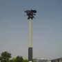 Polish Cavalry Monument on a tall pillar above a grassy mound, with dark horse and rider figures at the top.