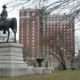 Ambrose Burnside Monument, a bronze equestrian statue on a stone pedestal in an urban park.