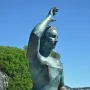 Dona Marinera bronze statue of a woman shading her eyes and looking out to sea.