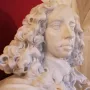 Bust of Francesco I d\'Este in white marble, showing a man with a curly wig and ruffled collar on a pedestal.
