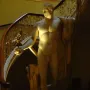 Napoleon as Mars the Peacemaker marble statue of a nude male figure holding a staff and orb beside a staircase