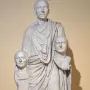 Togatus Barberini, a marble statue of a standing man in flowing robes holding two sculpted heads.