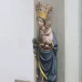 Inkpot Madonna, a colorful statue of the Virgin Mary holding the Christ Child, with an inkpot in her hand.